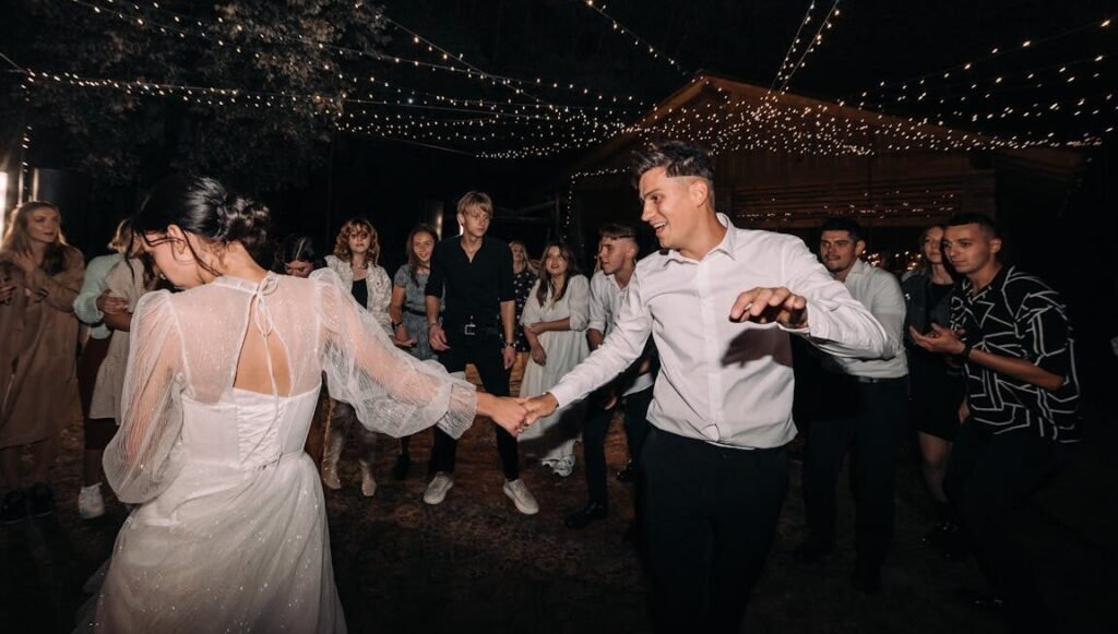consultation Newlyweds Dancing in a Crowd at Night